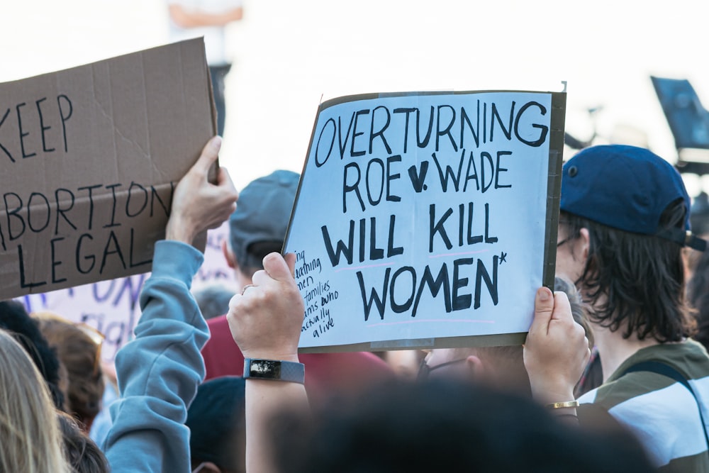 a group of people holding signs