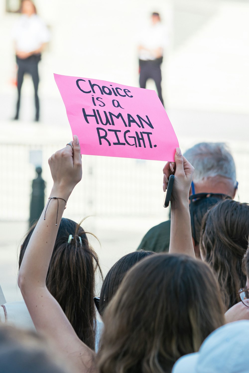 a group of people holding a sign