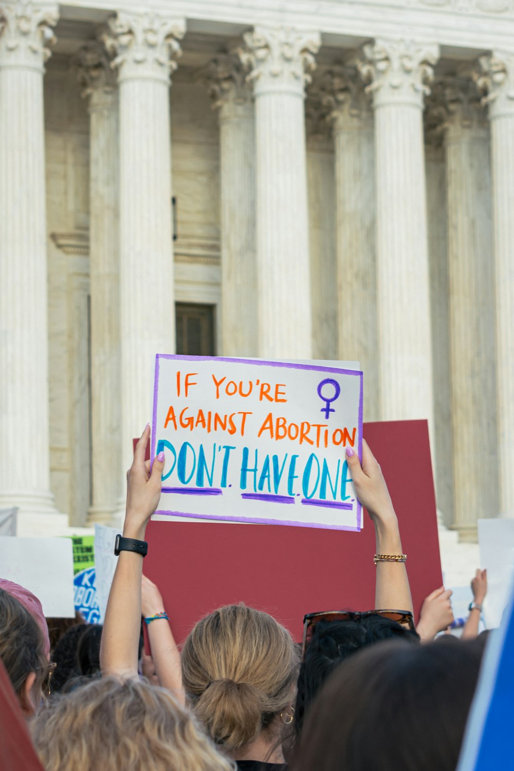 a group of people holding a sign