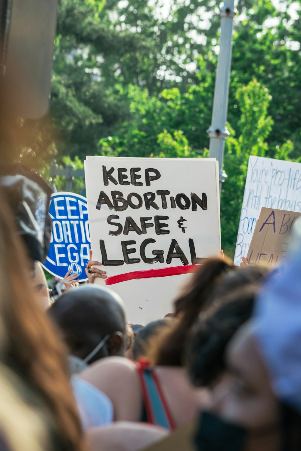 a group of people holding signs