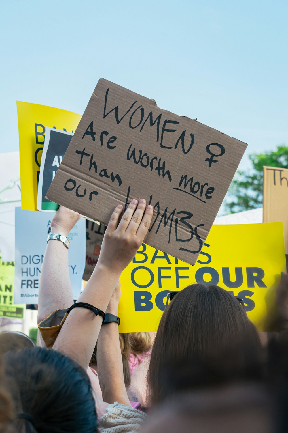 a group of people holding signs