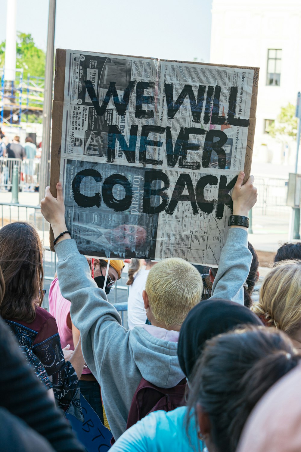 a group of people holding signs