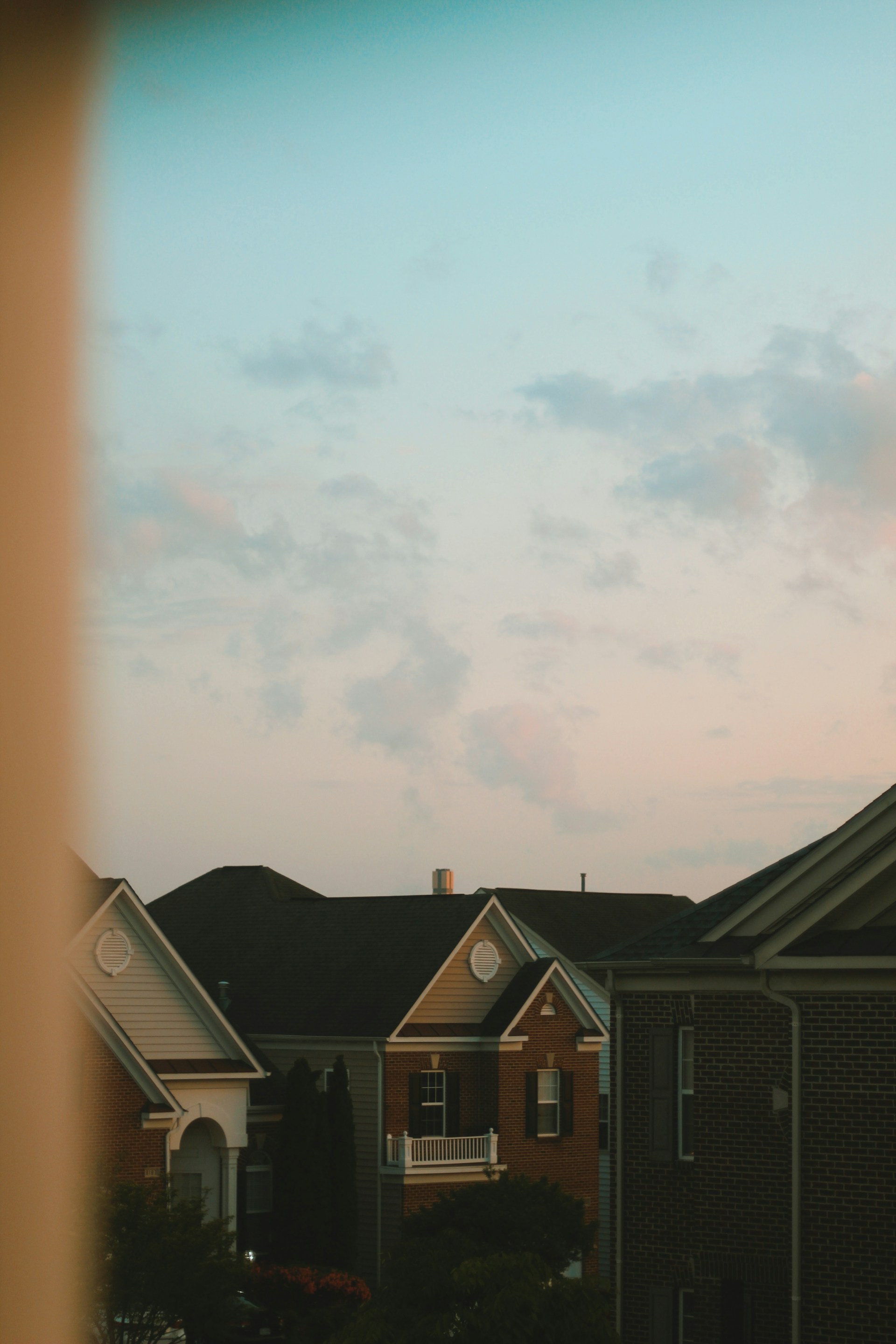 woman wearing yellow long-sleeved dress under white clouds and blue sky during daytime