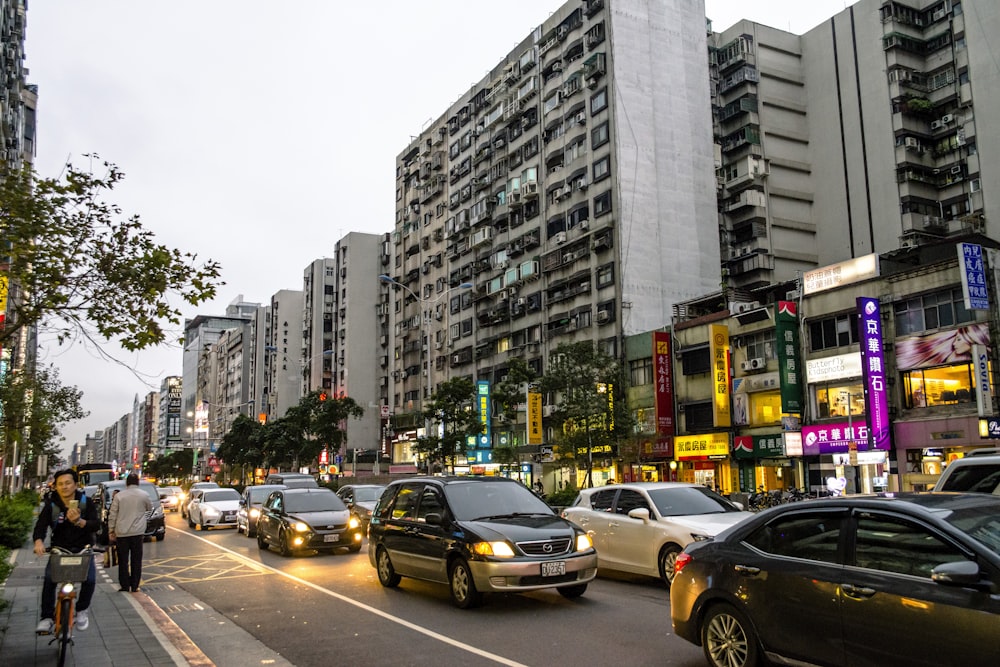 a busy street with cars and people