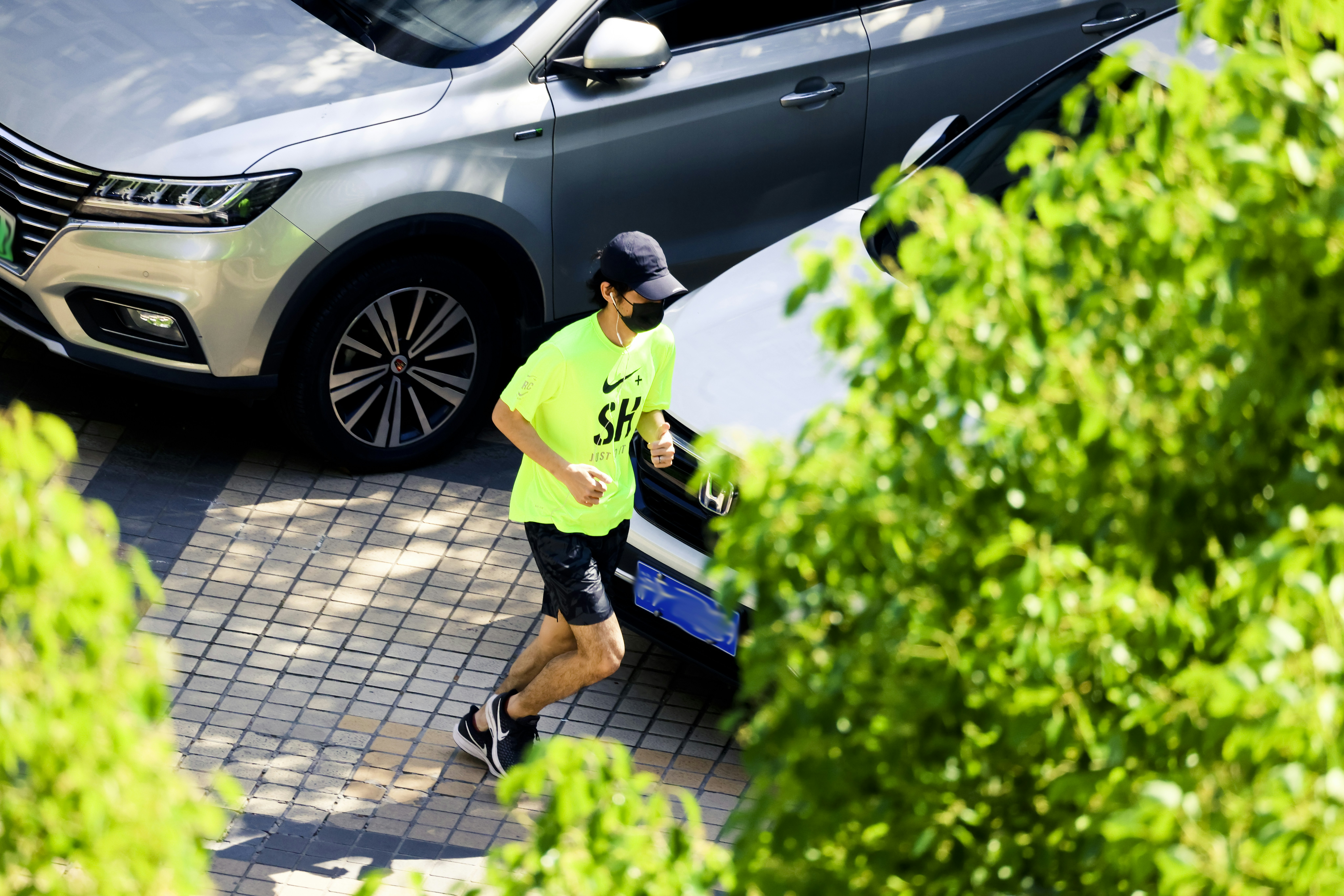 a man walking on a sidewalk