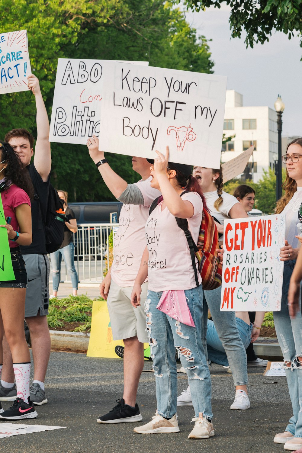 a group of people holding signs