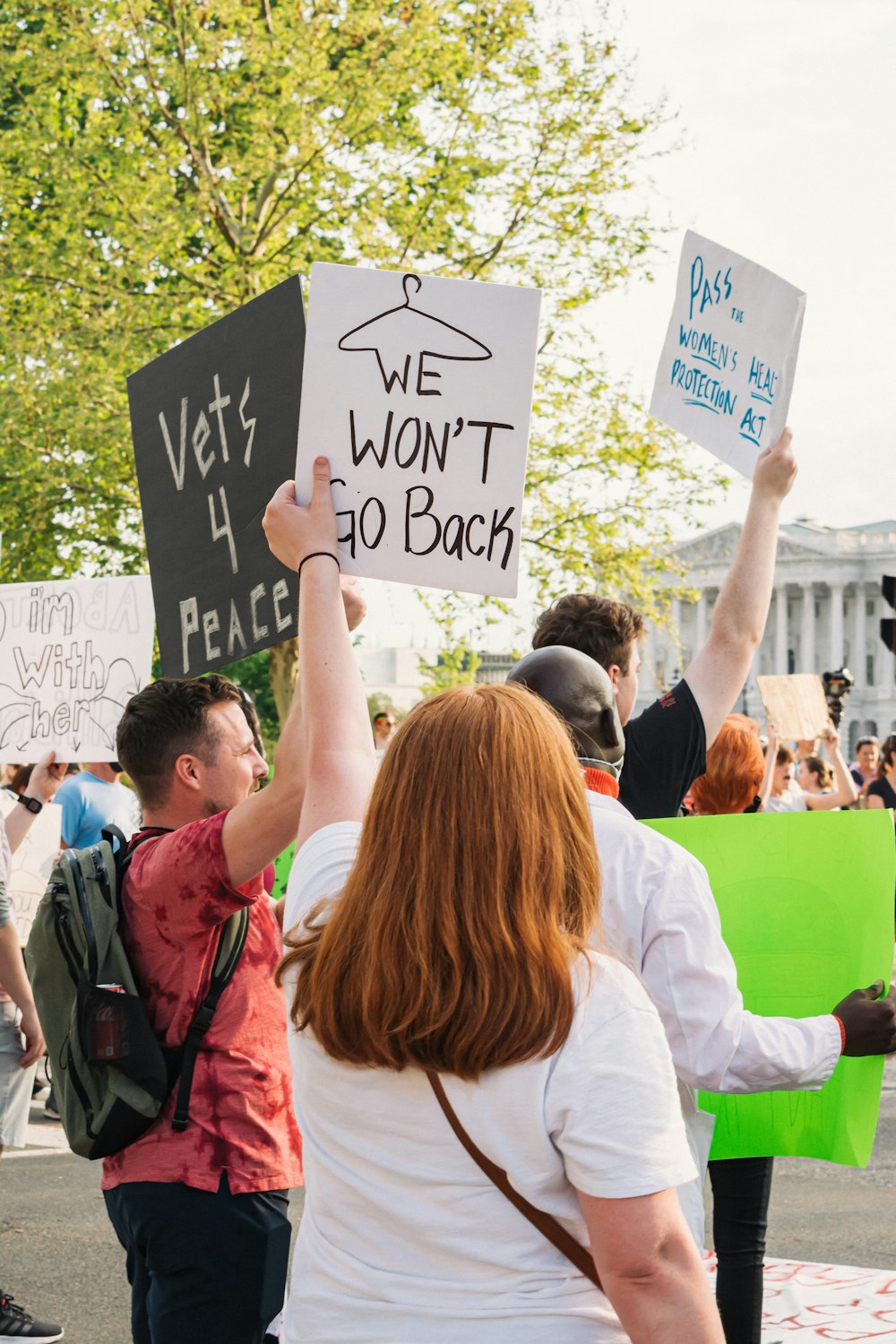 a group of people holding signs