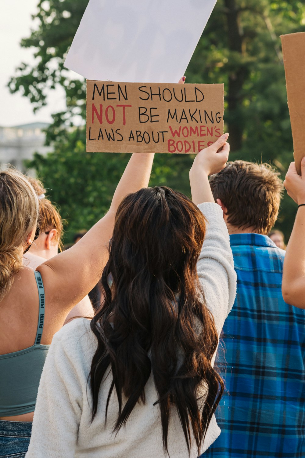 a group of people holding a sign