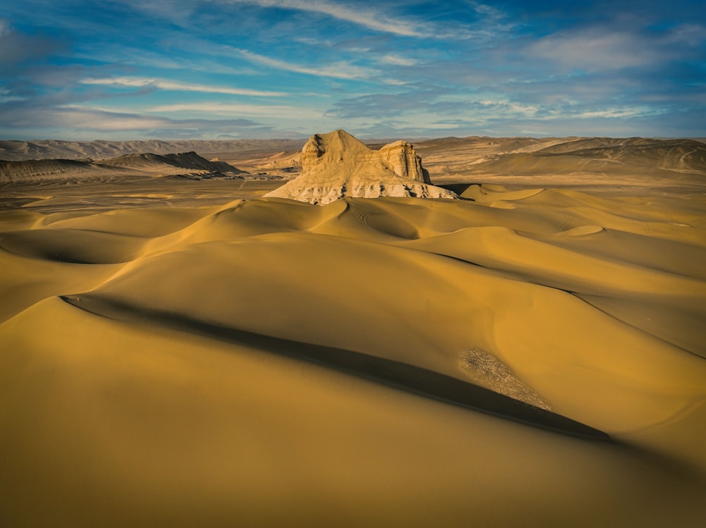 a desert landscape with sand dunes