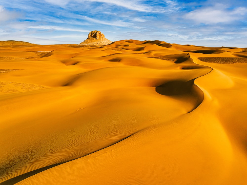 a desert landscape with sand dunes