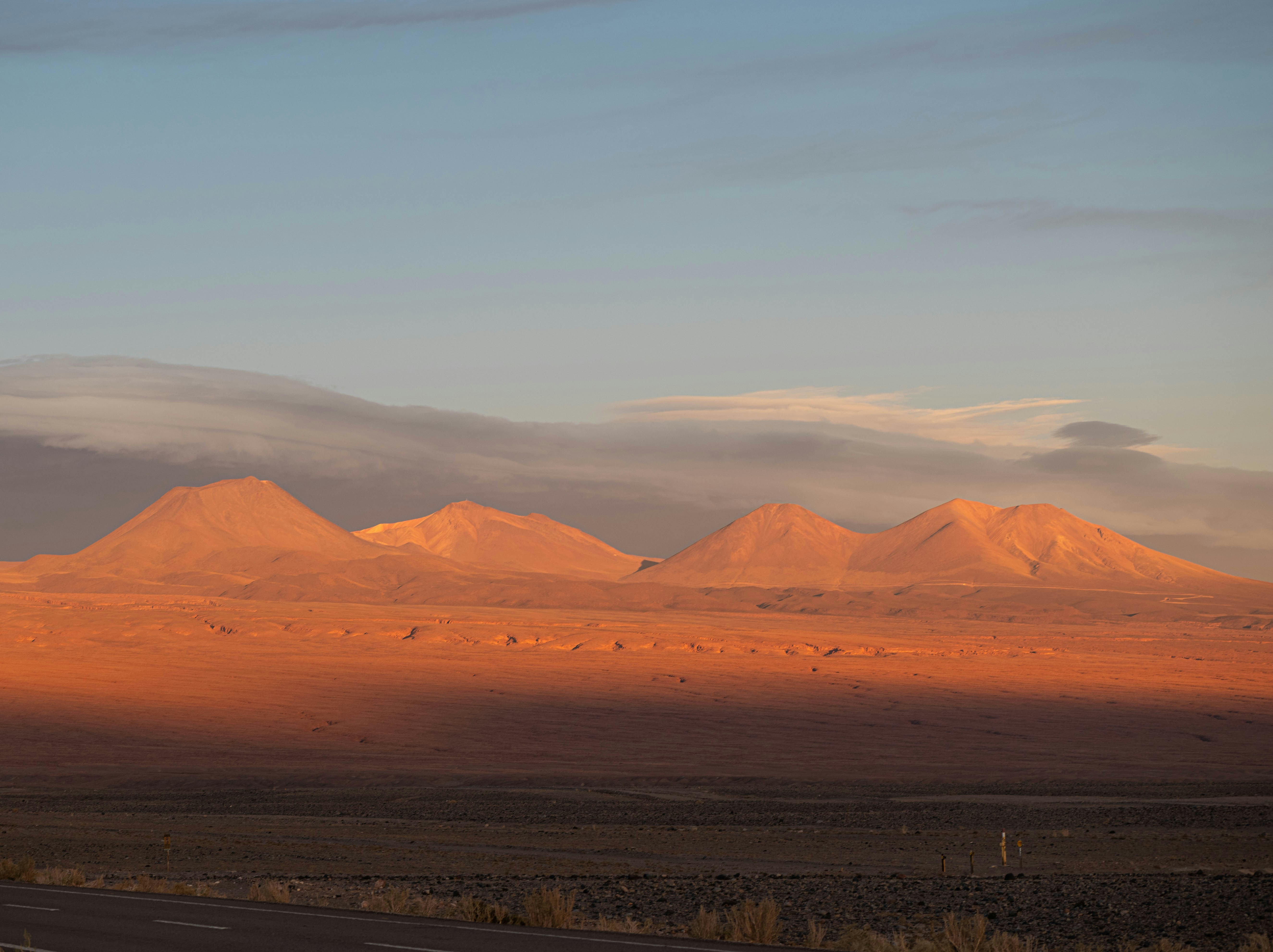a desert landscape with mountains in the distance