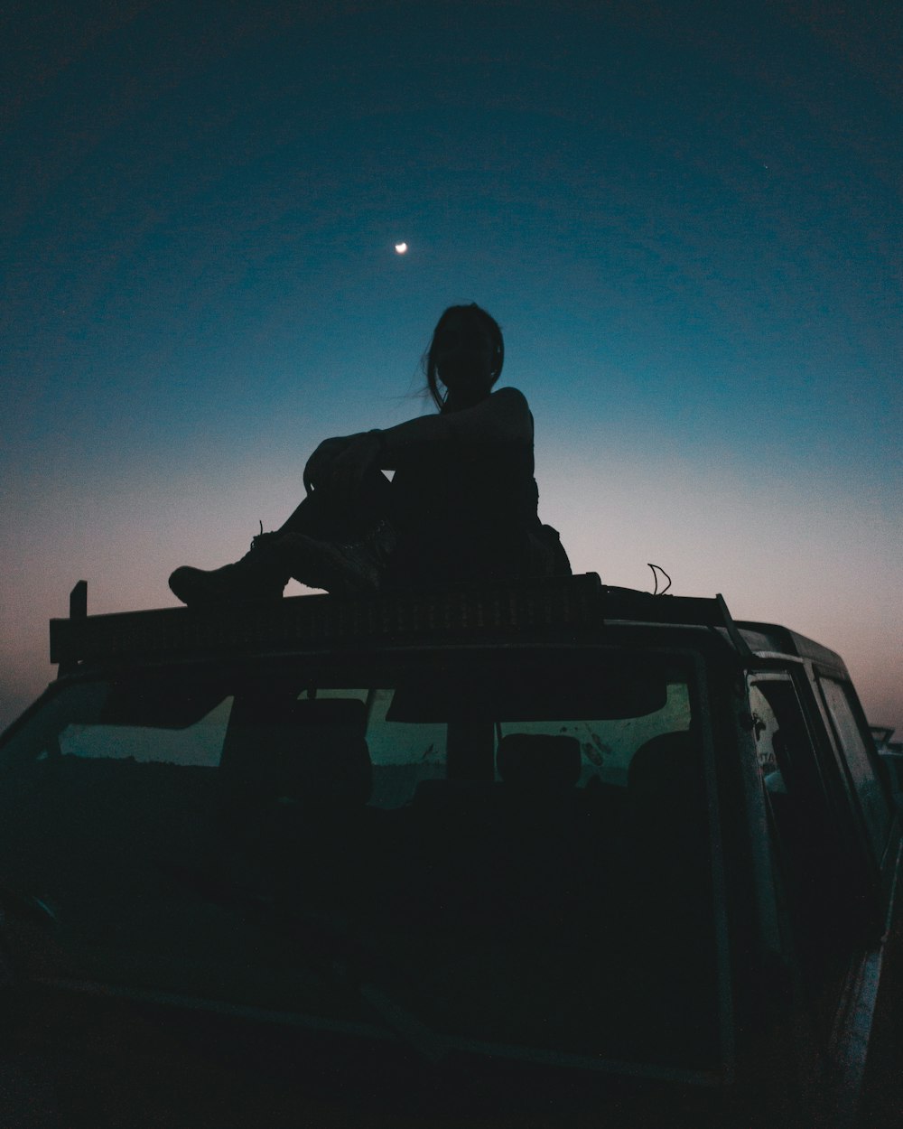 a person sitting on a car