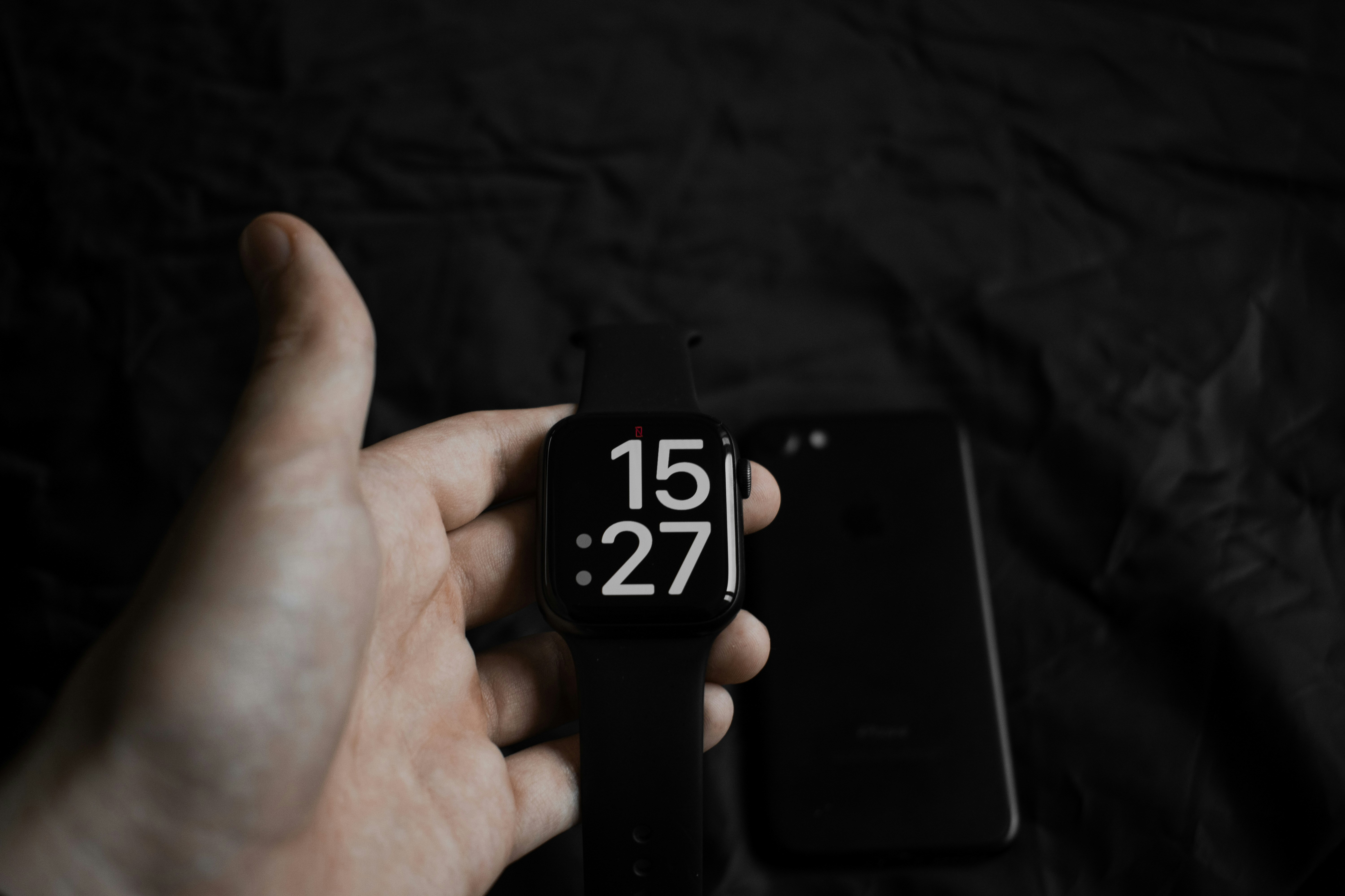 a person holding a small black device