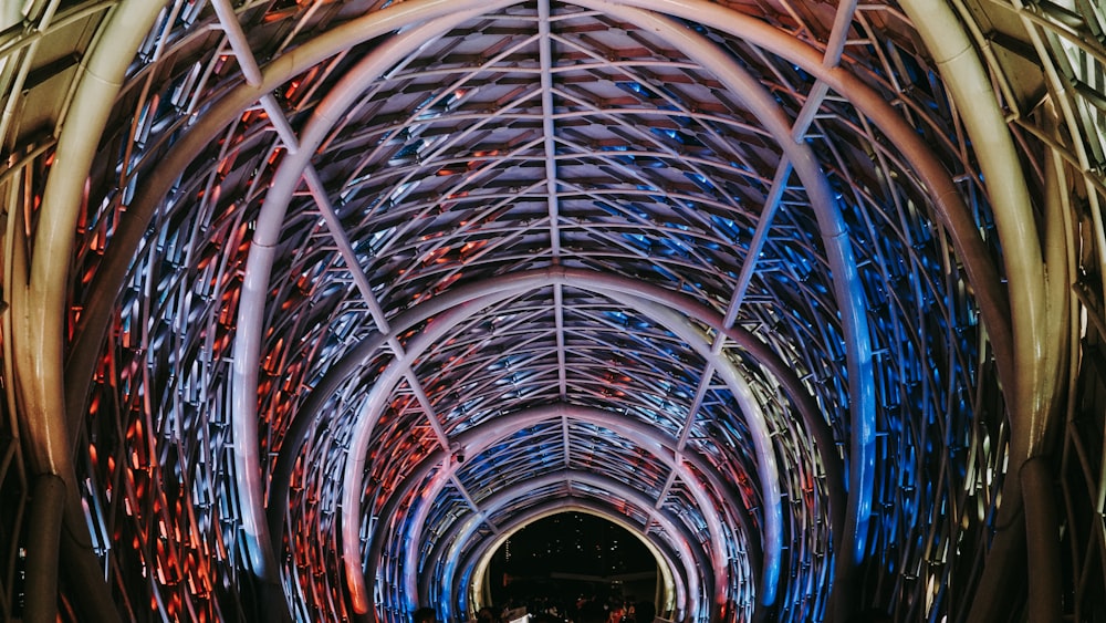 a colorful ceiling with many lights with Sainte-Chapelle in the background