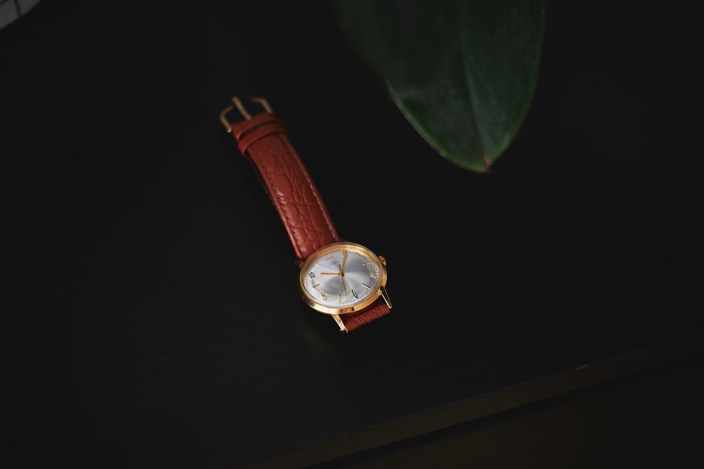a watch on a leaf
