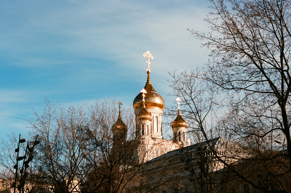 a building with a gold cross on top