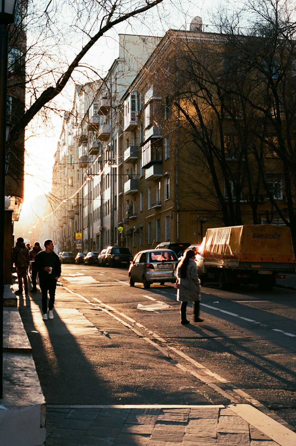 a street with cars and people on it