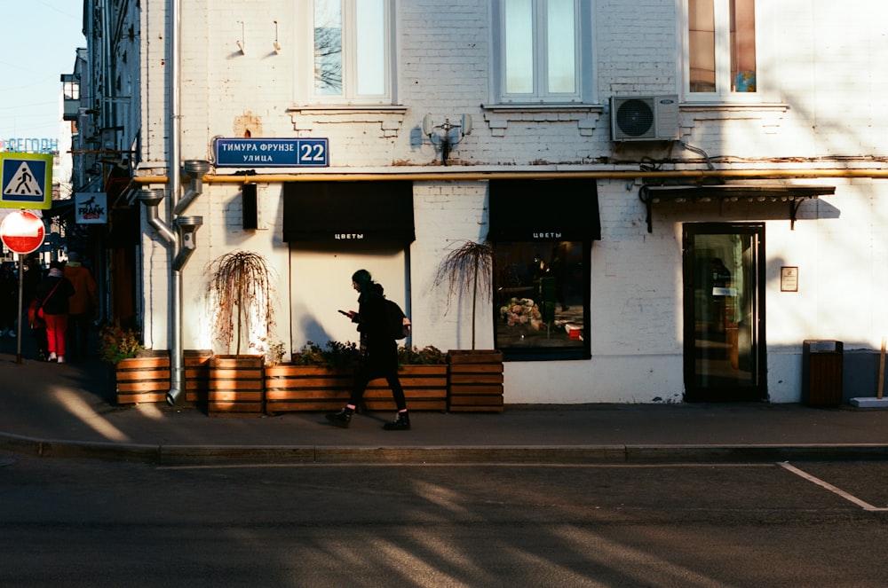 a person walking on the sidewalk