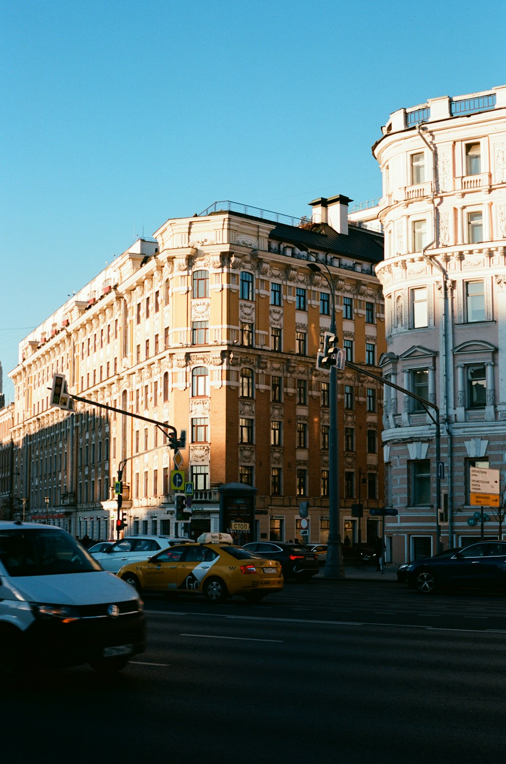 a street with cars and buildings along it