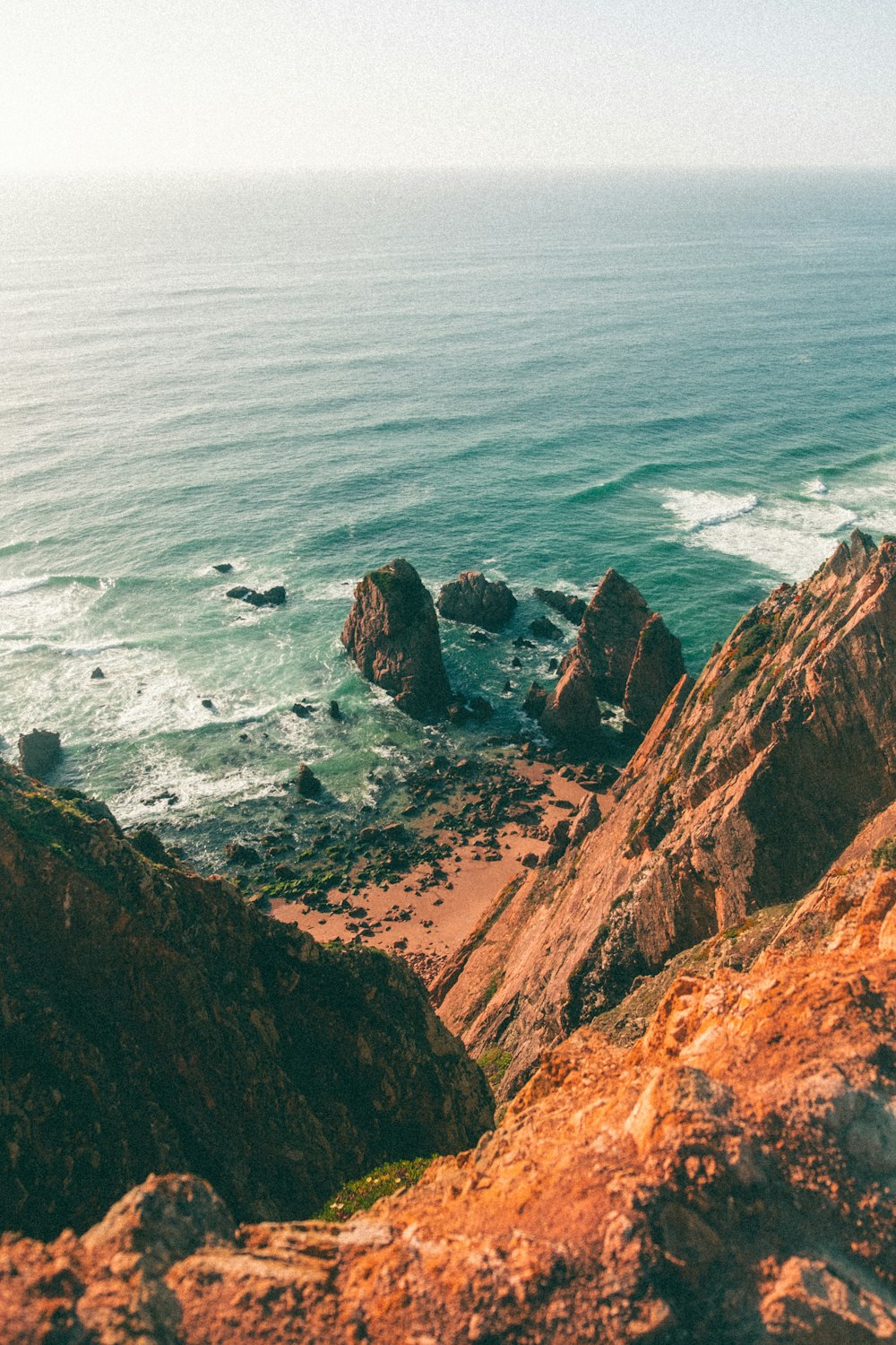 a rocky cliff overlooking the ocean