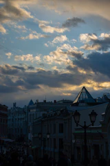 A detailed sketch of a cityscape at dusk with intricate line work.