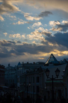 A detailed sketch of a cityscape at dusk with intricate line work.