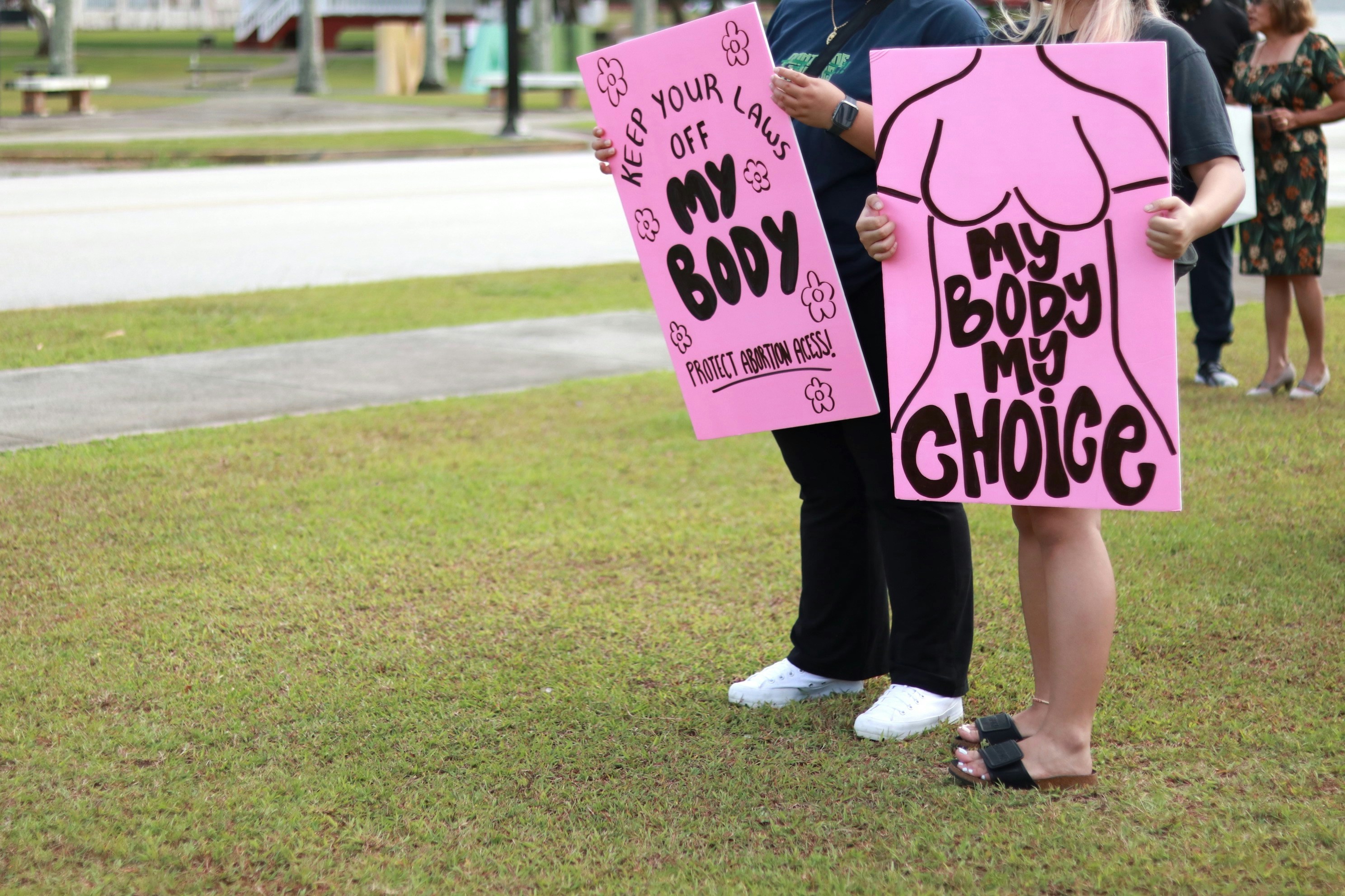 a group of people holding signs