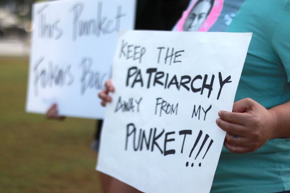 a person holding a sign