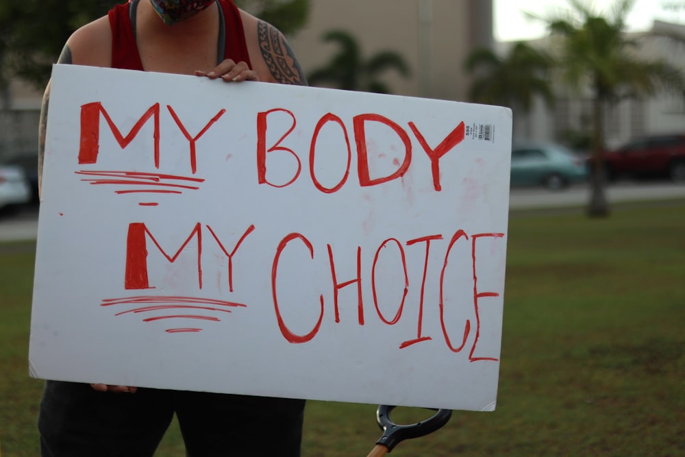 a person holding a sign