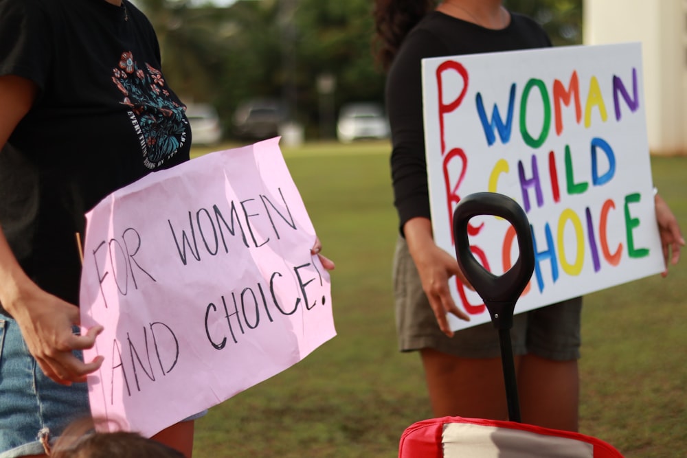 a group of people holding signs