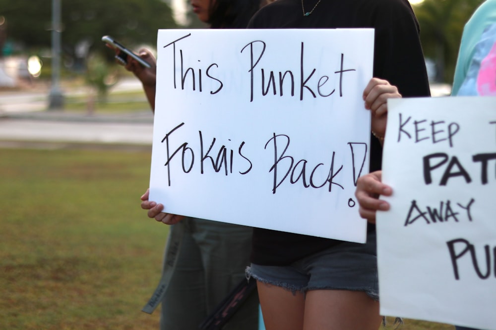 a person holding a sign