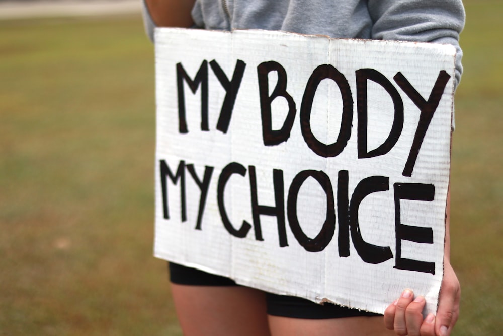 a person holding a sign