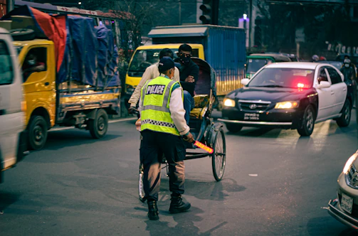 Police officers managing traffic during a busy festival day in an Uttar Pradesh city.