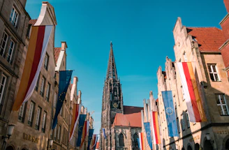 a group of buildings with flags