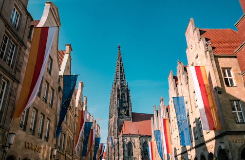 a group of buildings with flags