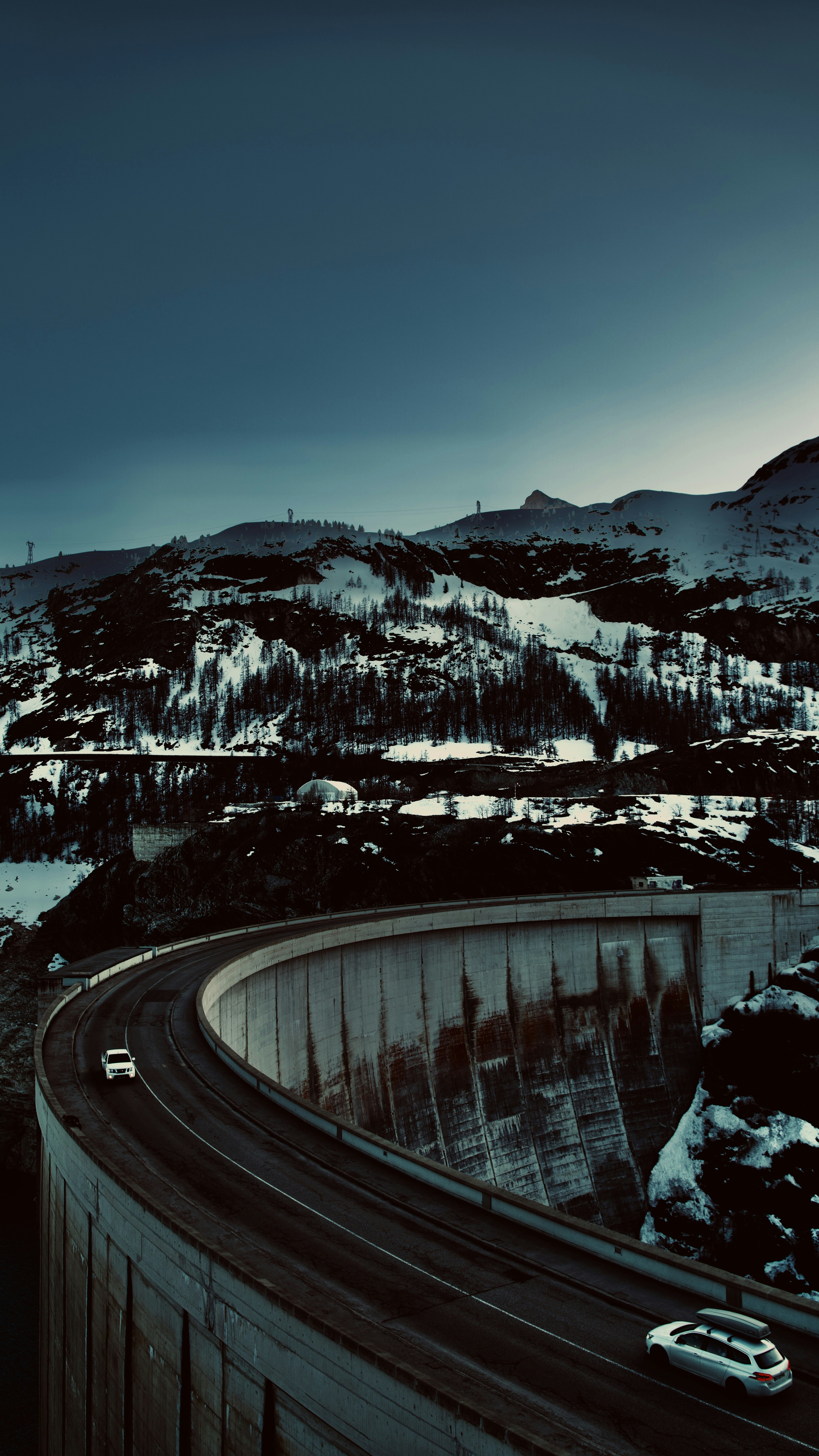 a large dam with a snowy landscape