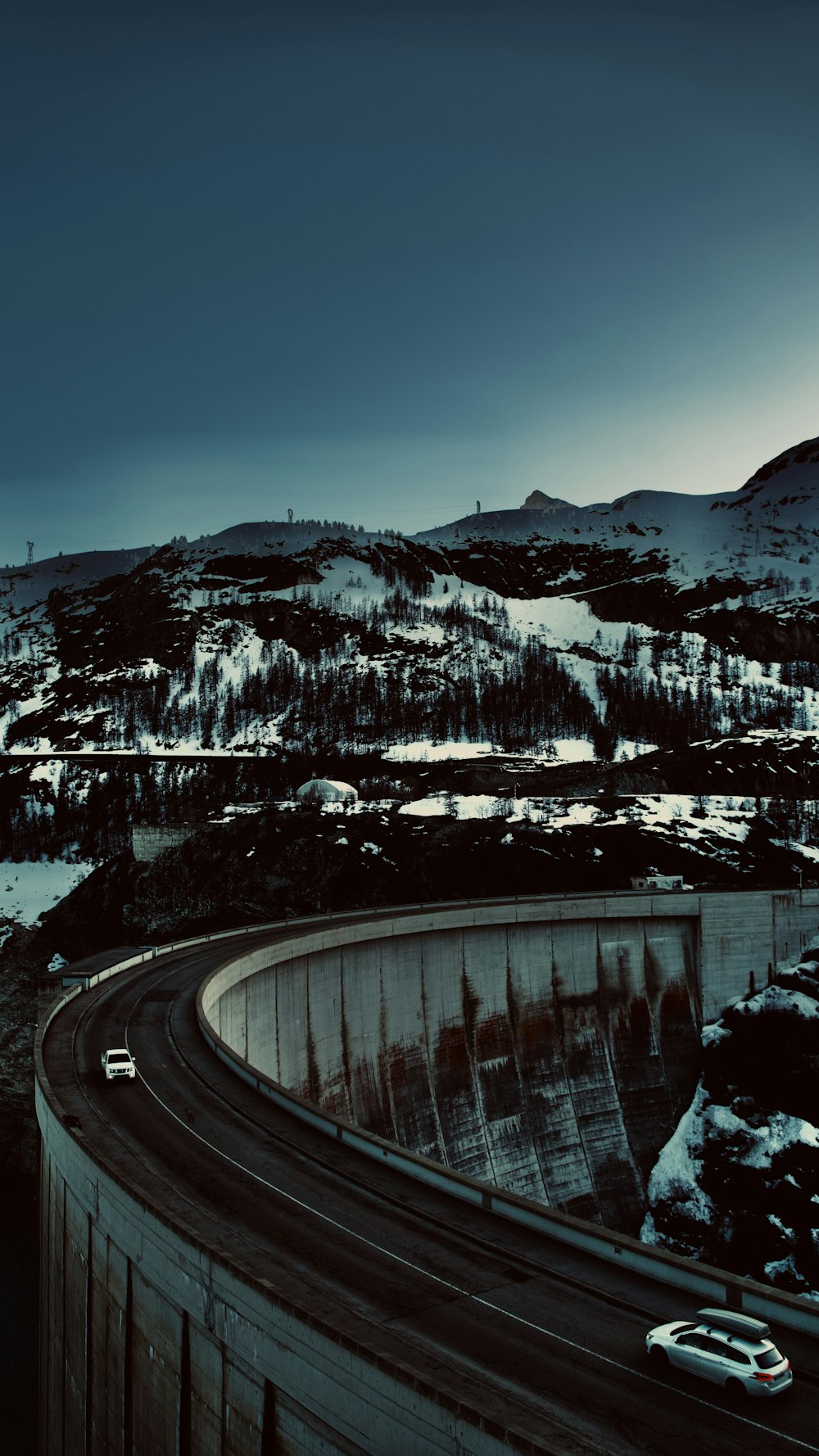 a large dam with a snowy landscape