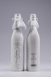 Elegant glass bottles of moisturizing lotions with floral decorations