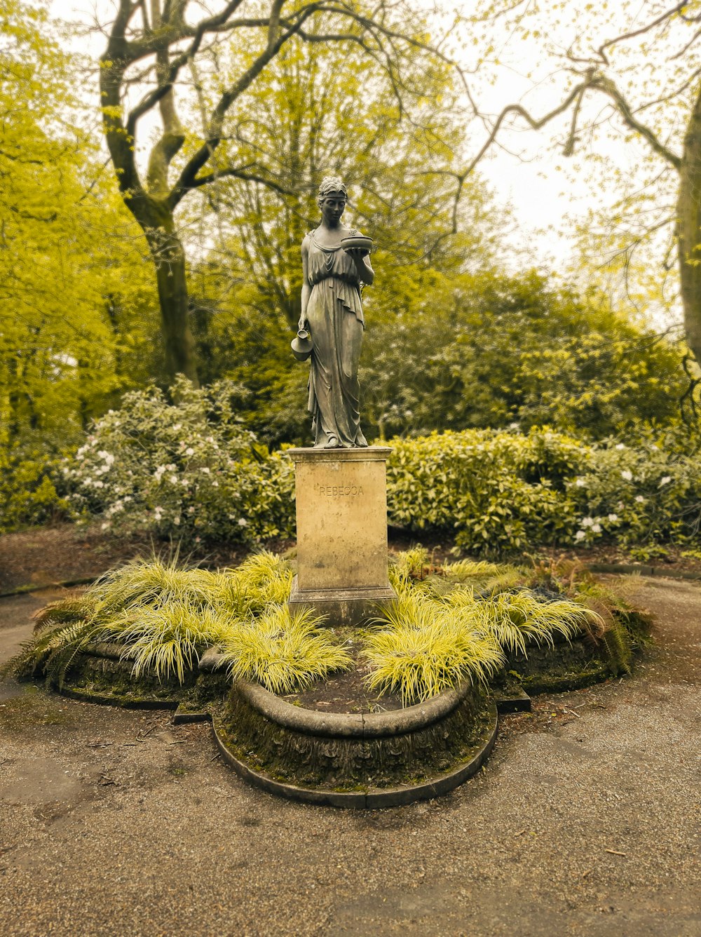 a statue in a garden