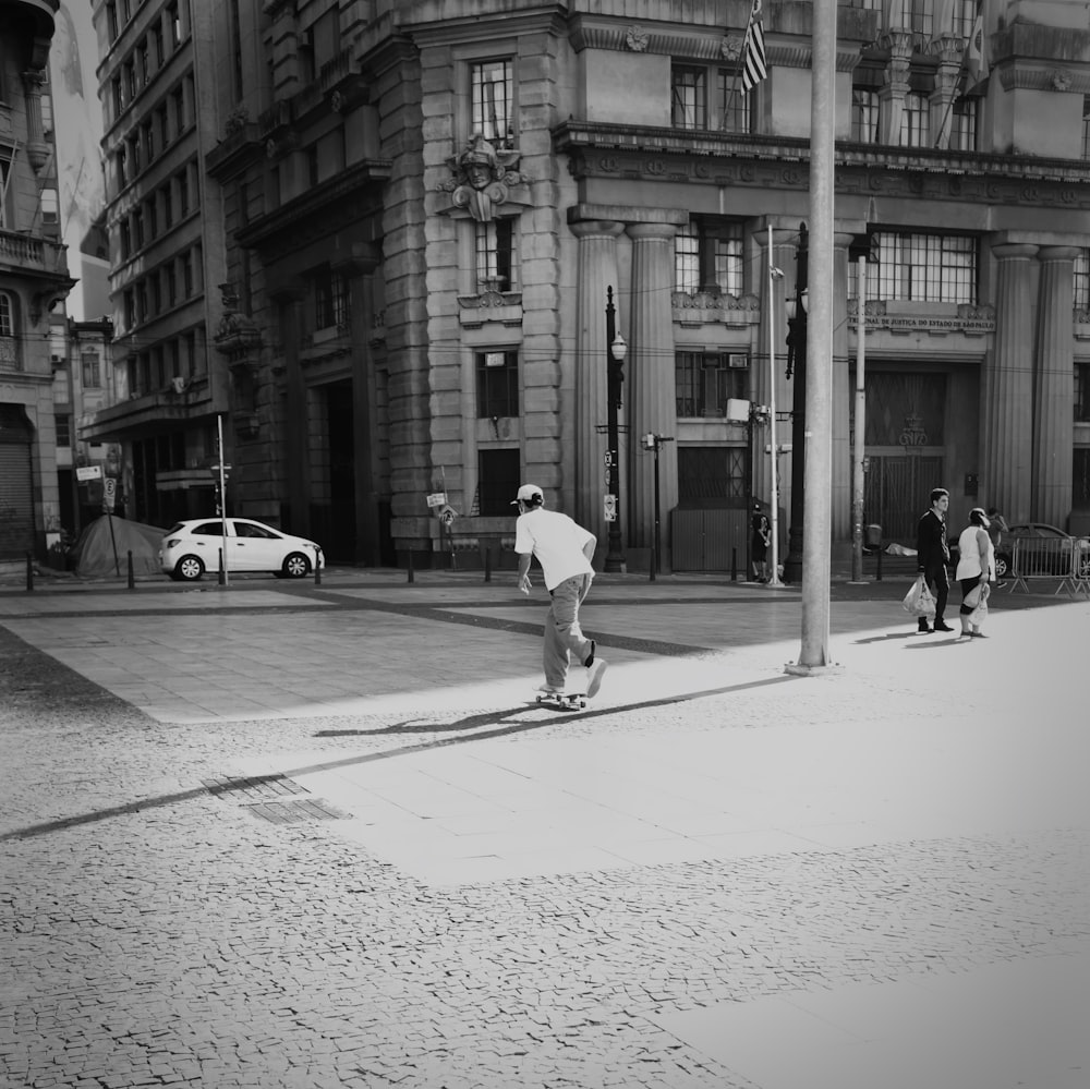 a person skateboards down a sidewalk