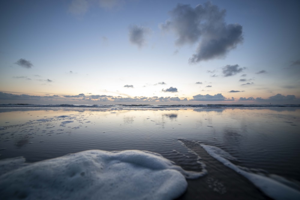 a snowy landscape with clouds