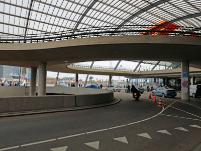 a road with cars and a bridge