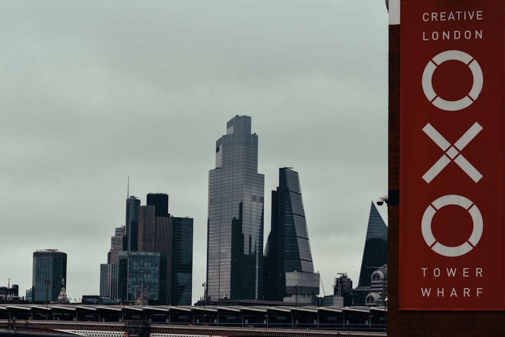 a city skyline with a sign