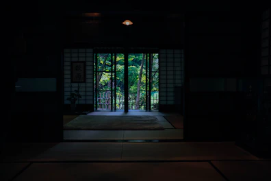 A peaceful dojo with wooden floors and traditional Japanese scrolls hanging on the walls.