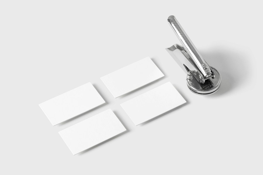 Blank business cards beside a pen