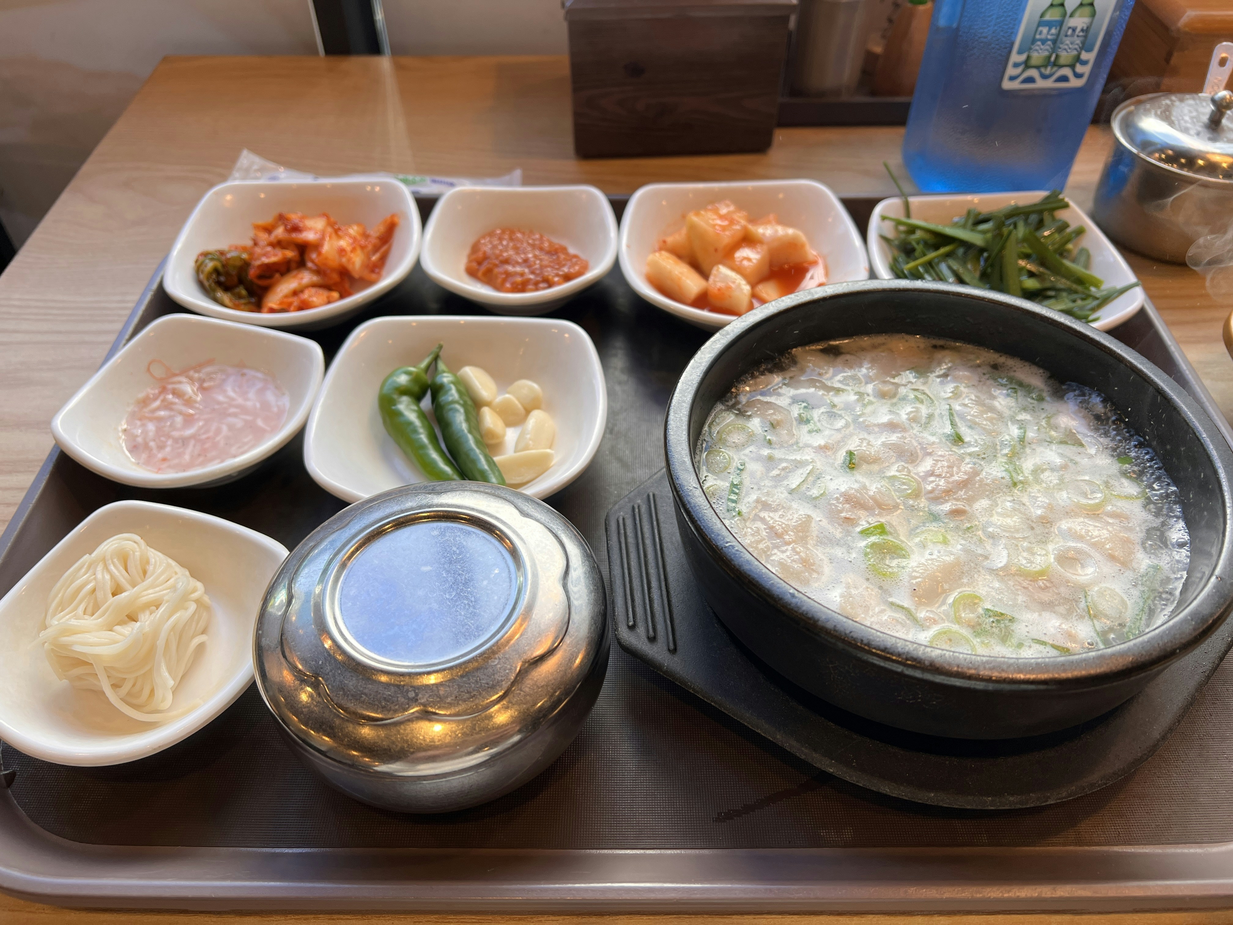 Korean blood sausage soup sundae gukbap in deep bowl with side dishes