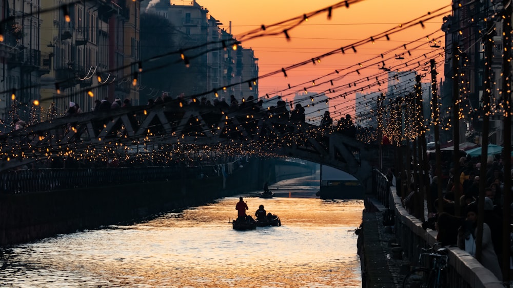 a bridge with lights and buildings