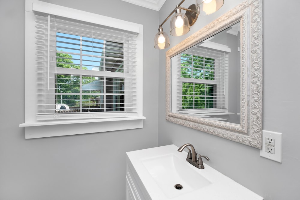 a bathroom with a sink and a window