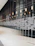 Close-up of a sleek metal wall hanging reflecting soft ambient light in a modern living room.