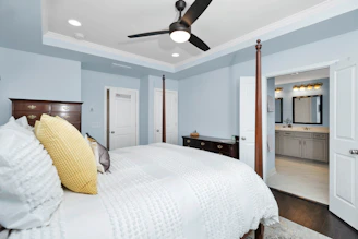 a bedroom with a large bed in a room